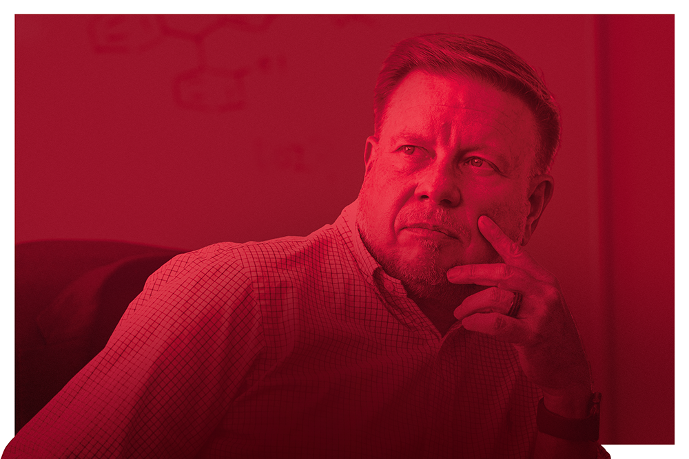 Doug Frantz looks toward the future while resting his cheek on his fingertips